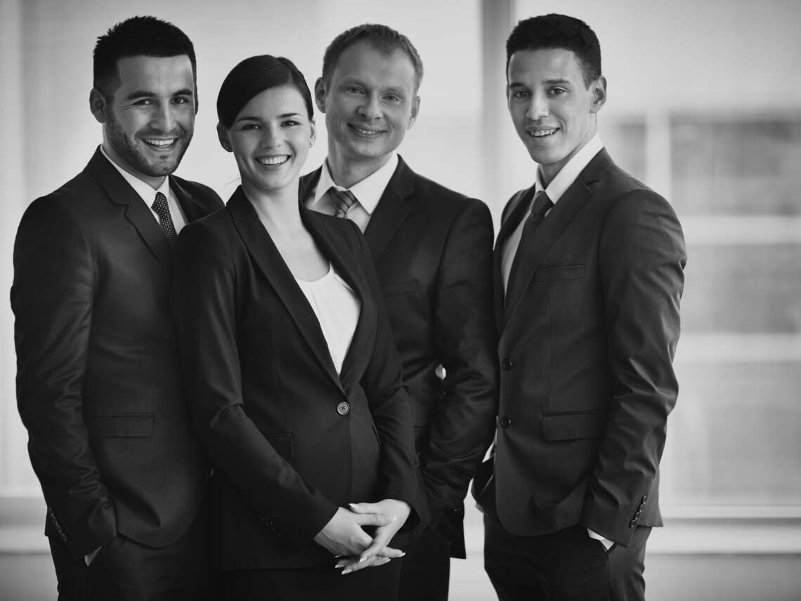 well-dressed-businesspeople-office -  - Homepage